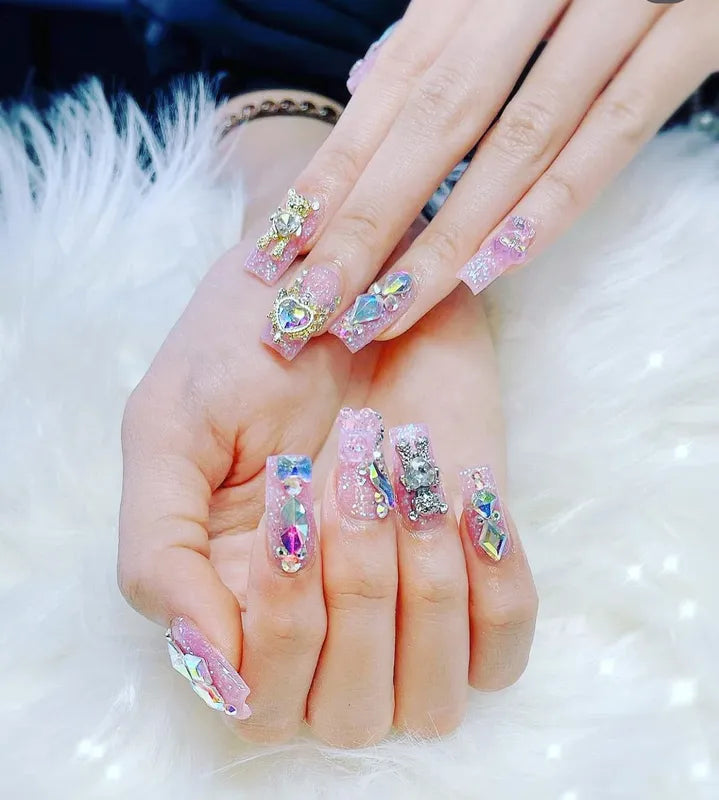 Crystal-embellished pink nails with intricate 3D art from Nail Shadow