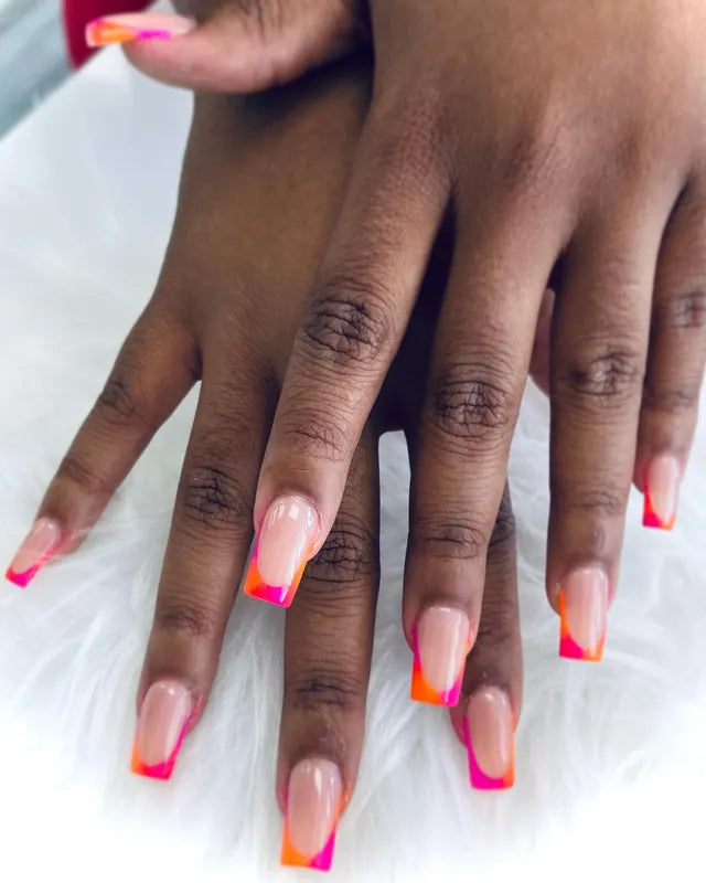 Bright coral pink French manicure on natural nails by Nail Shadow.